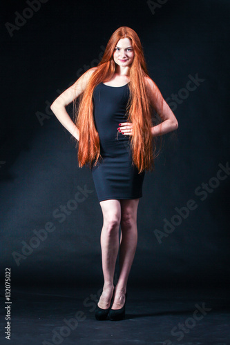 Beauty ginger Girl Portrait. Healthy Long Red Hair. Beautiful Yo