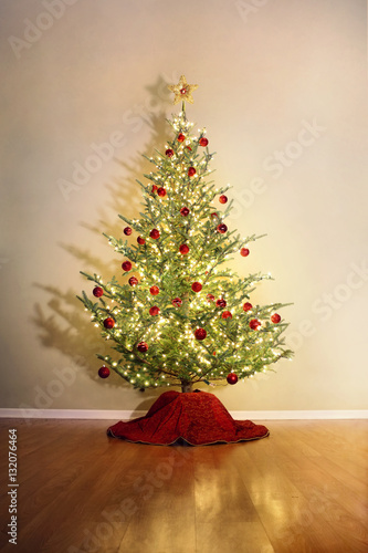 Christmas tree with red ball ornaments and shadow photo