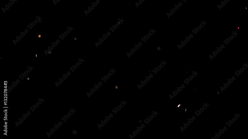 Particles flying on a black background. Colored particles flying erratically. Particles flying on a black background. Colored particles flying erratically.