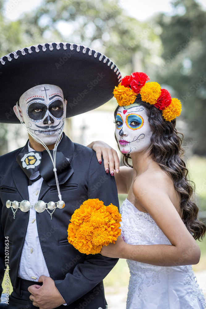 Bridal couple with makeup and costumes typical Mexican in a ceme Bridal couple with makeup and costumes typical Mexican in a ceme