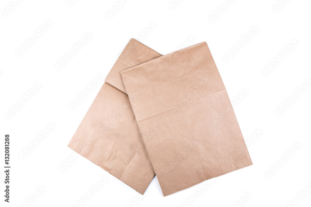 Plain brown paper shopping bag isolated on a white background Plain brown paper shopping bag isolated on a white background