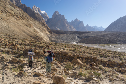 Porters walk toward to Baltoro glacier, K2 trek, Pakistan