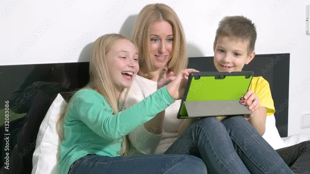 Attractive young family using a tablet to make future plans Attractive young family using a tablet to make future plans