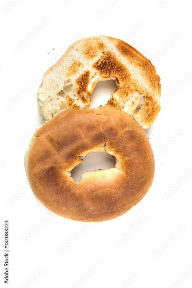 Plain white toasted bagels isolated on a white background Plain white toasted bagels isolated on a white background