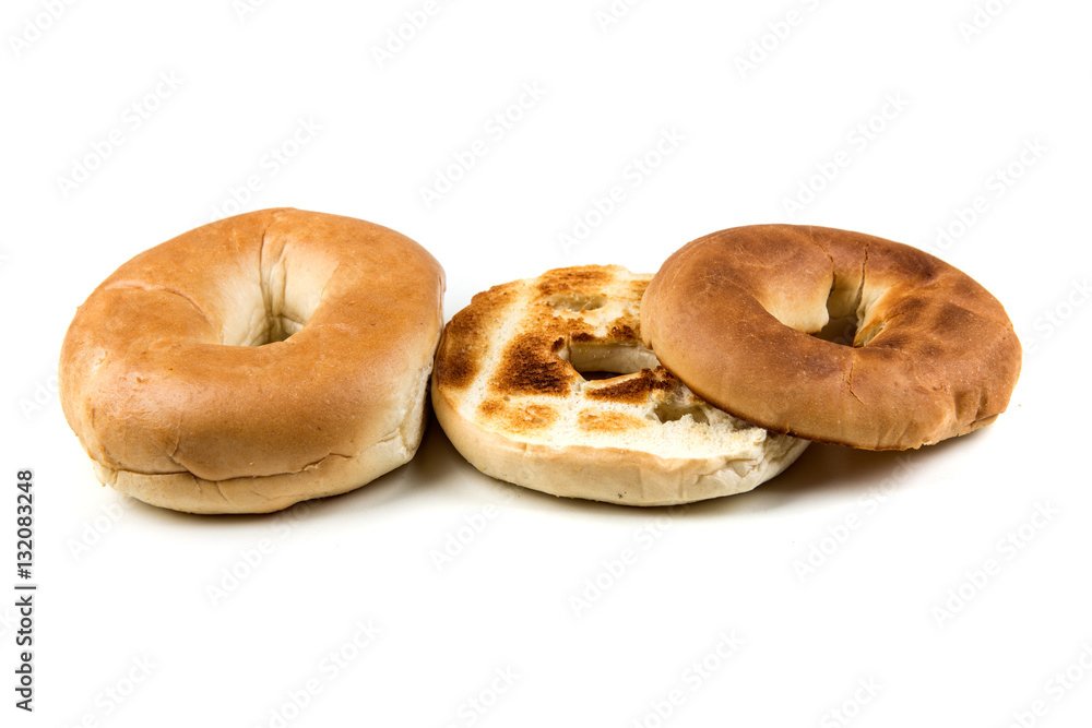 Plain white toasted bagels isolated on a white background Plain white toasted bagels isolated on a white background