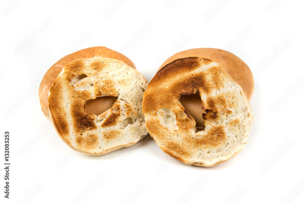 Plain white toasted bagels isolated on a white background Plain white toasted bagels isolated on a white background