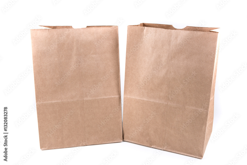 Plain brown paper shopping bag isolated on a white background Plain brown paper shopping bag isolated on a white background