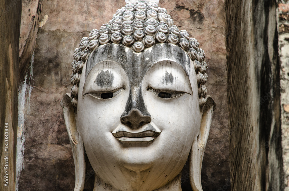 ancient old buddha in thailand , closed up on face