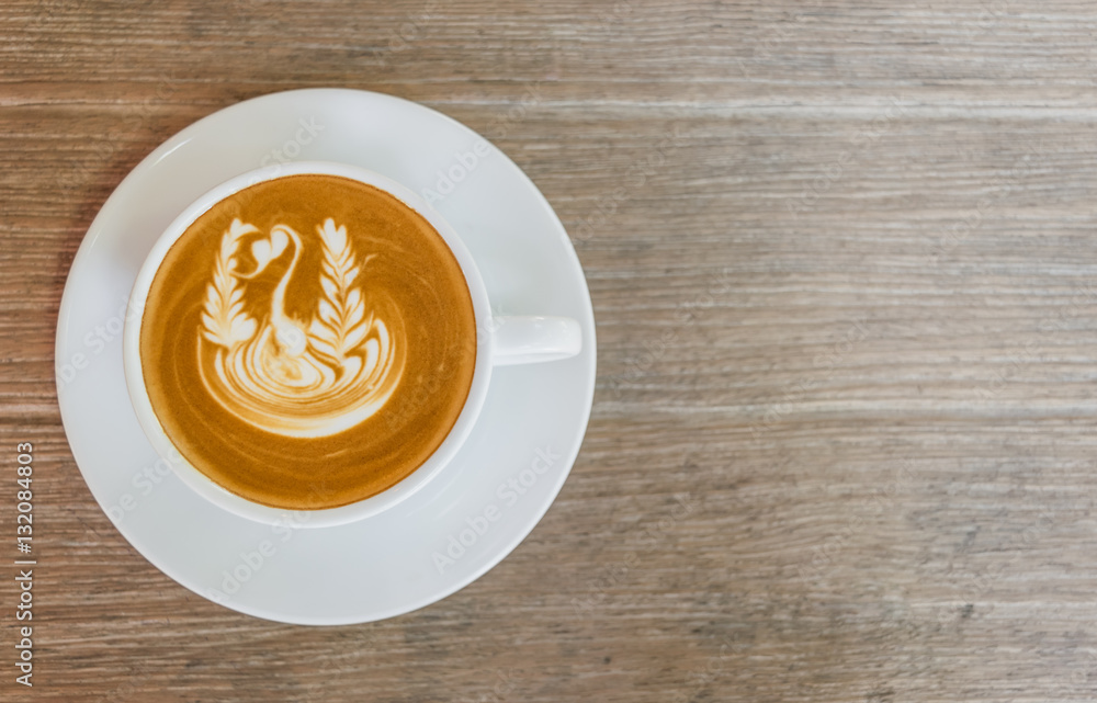 Close up white cup of Coffee, latte with beautiful latte art on the wooden table. Close up white cup of Coffee, latte with beautiful latte art on the wooden table.