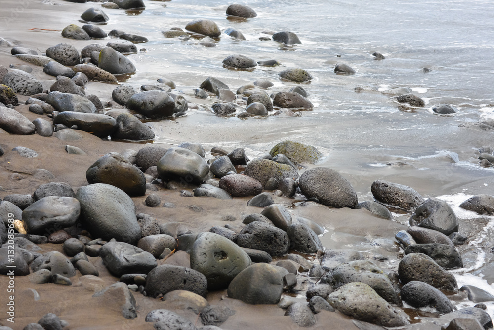 Black sand beach, volcanic stones, Tahiti Black sand beach, volcanic stones, Tahiti