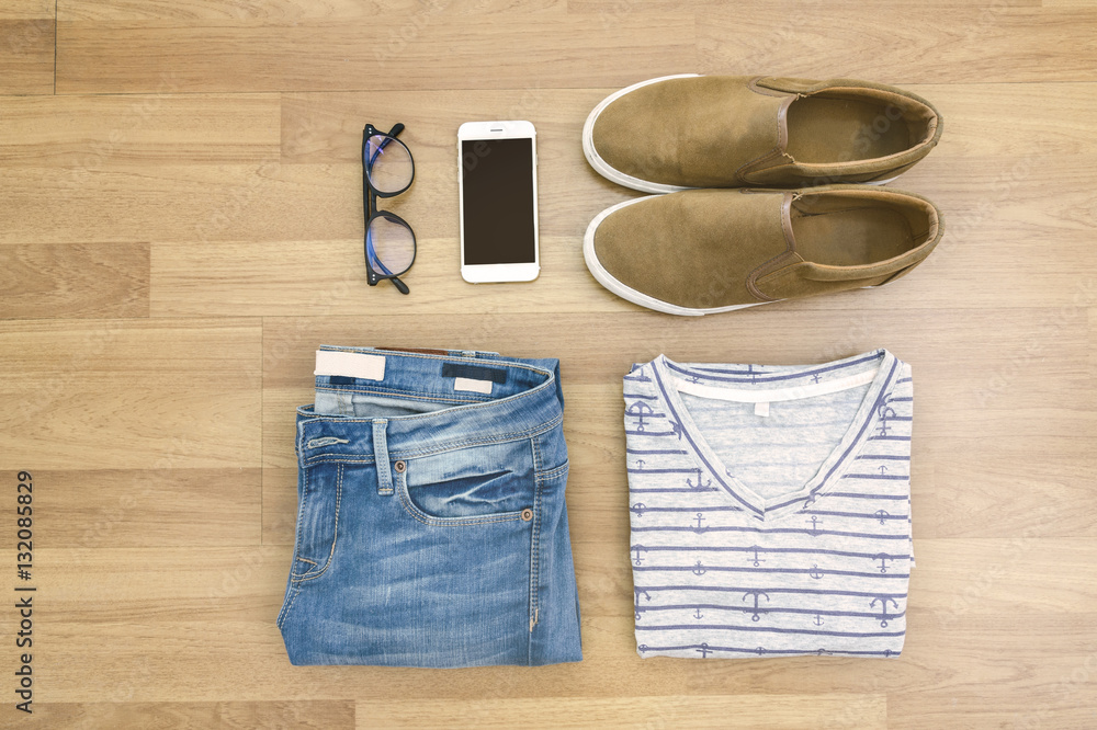 Flat lay clothes and accessories collage on the wooden backgroun Flat lay clothes and accessories collage on the wooden backgroun