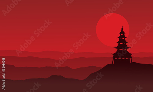Silhouette of pagoda with moon scenery