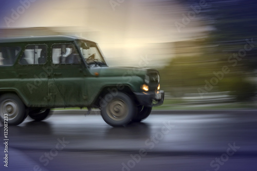 SUV on road © OlegOk