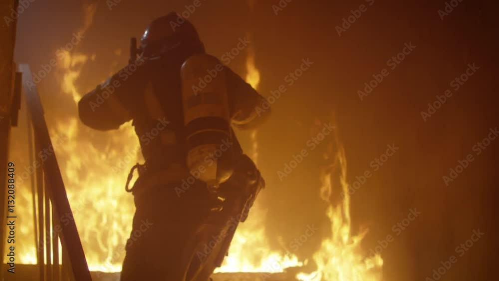 Brave Firefighter Runs Up The Stairs. Raging Fire is Seen Everywhere. Shot on RED EPIC (uhd). Brave Firefighter Runs Up The Stairs. Raging Fire is Seen Everywhere. Shot on RED EPIC (uhd).