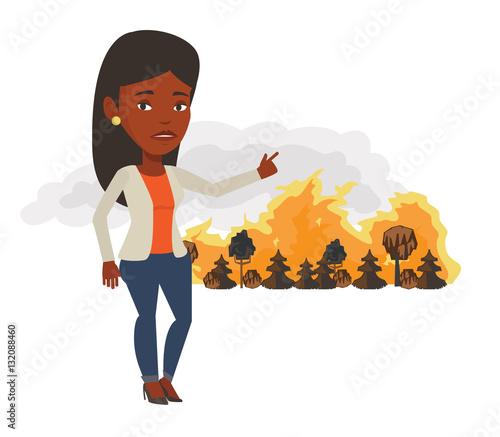 Woman standing on background of wildfire.