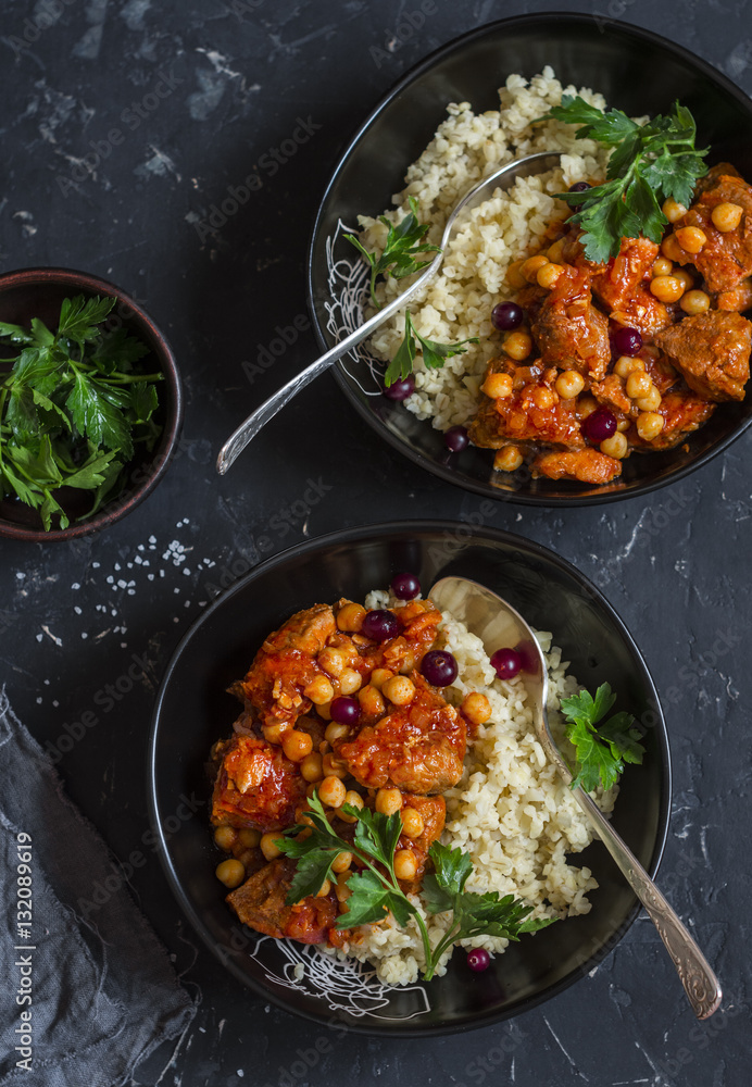 Lamb stew and bulgur. Delicious lunch. On a dark background, top view Lamb stew and bulgur. Delicious lunch. On a dark background, top view
