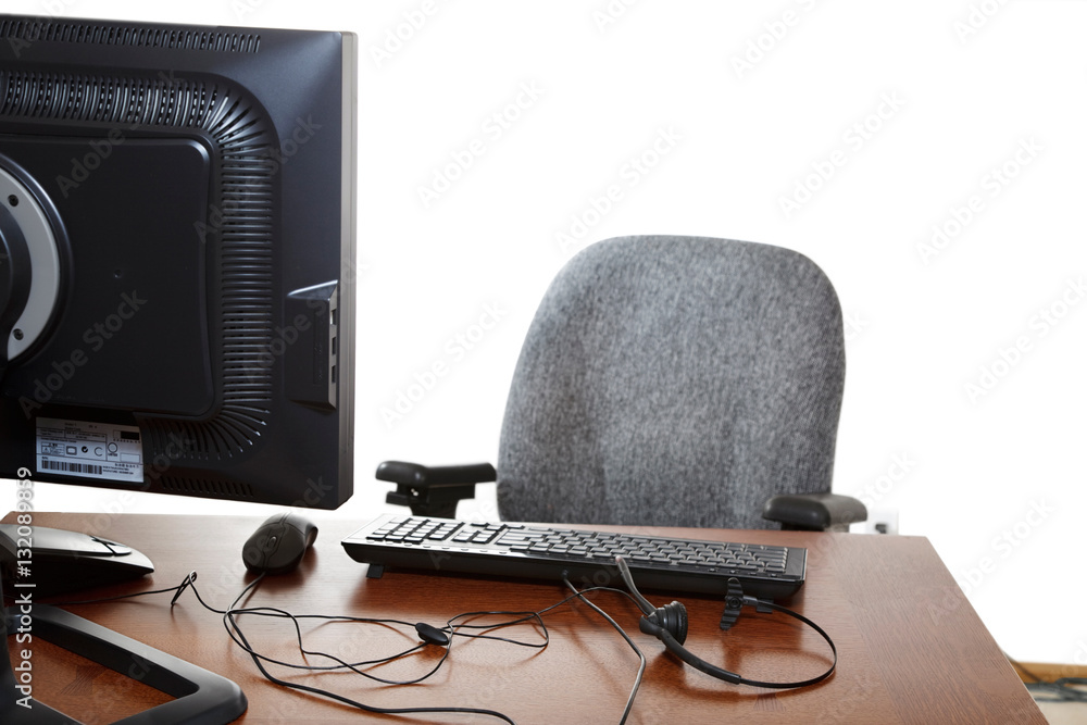 Empty desk - Customer service representative's desk, with headset & computer Empty desk - Customer service representative's desk, with headset & computer