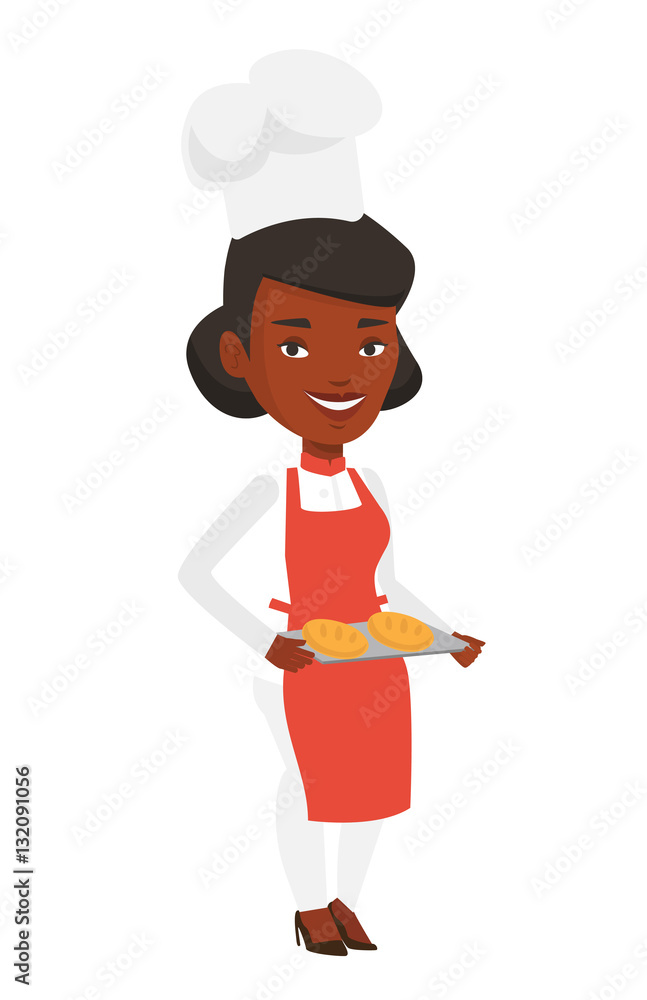 Happy young baker holding tray of bread. Happy young baker holding tray of bread.