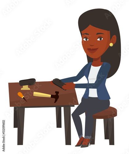 Shoemaker making handmade shoes in workshop.