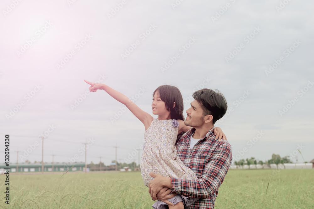 Father and daughter in happiness at the outside in the meadow Father and daughter in happiness at the outside in the meadow
