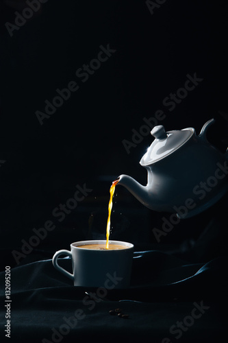 Pouring tea into a cup