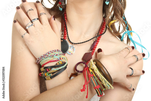 Close-up of female hands with accessories. Hippie style.