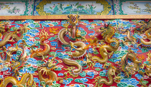 The golden dragon statue on wall