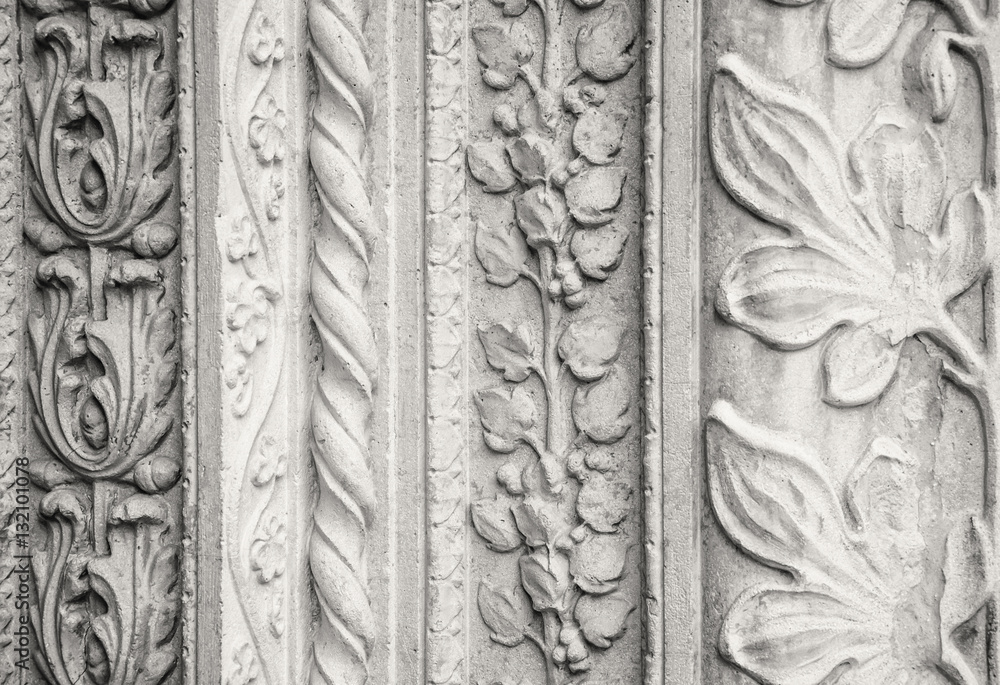 Carved stone decorations, outside a church in Italy. (sepia version).