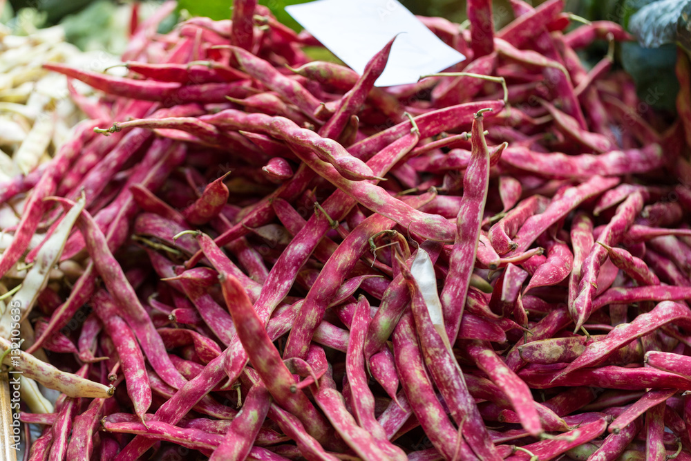 Fototapeta premium Pods of red beans on the counter farm market