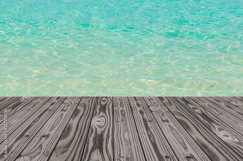Wood grain deck floor over beautiful sea water background