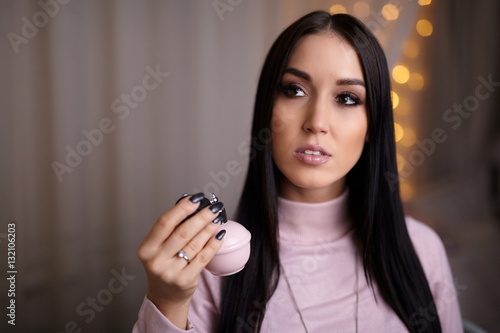 Beautiful woman in mirror with perfume
