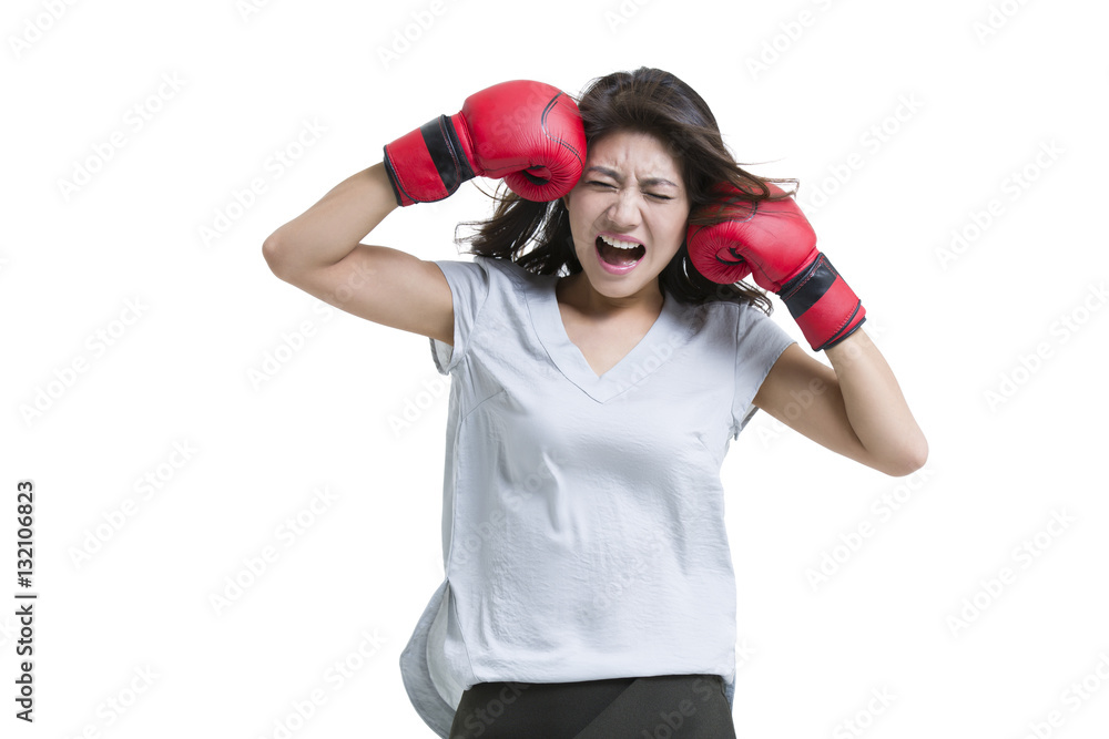 Young woman shouting with boxing gloves Young woman shouting with boxing gloves