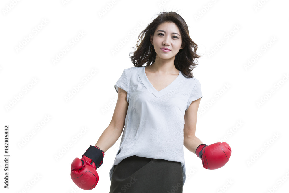 Confident young woman wearing boxing gloves Confident young woman wearing boxing gloves