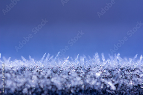 winter background with glittering ice crystals with copy space, macro photos. shallow depth of field