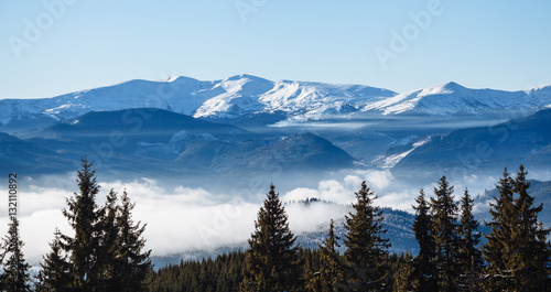 Winter mountains covered with fog © 4Max