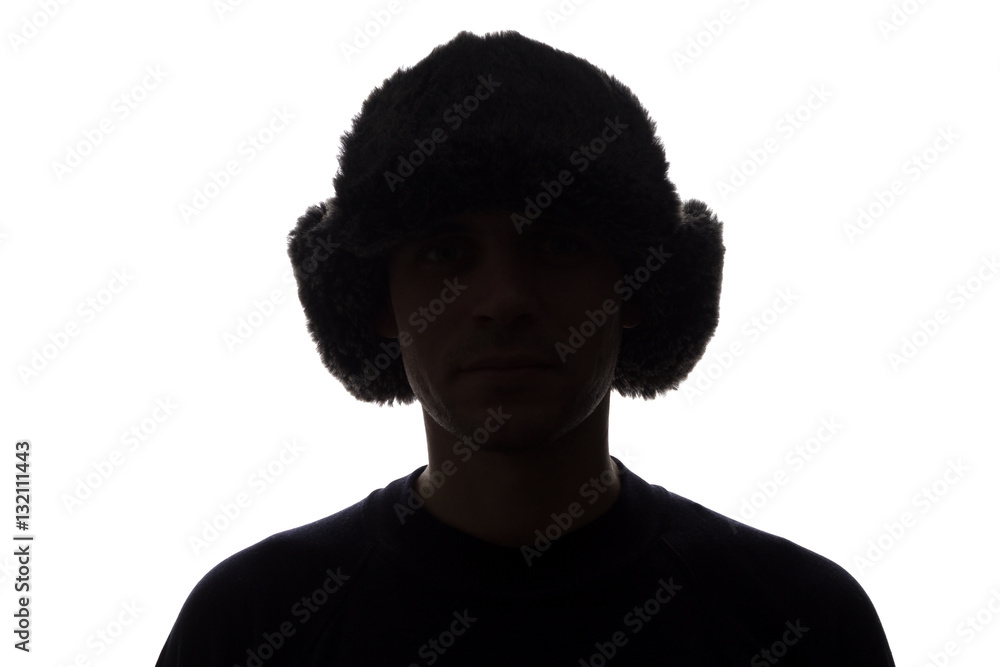 Young man in hat look ahead - horizontal silhouette
