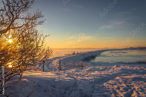 Tableau sur toile Winter landscape frozen ocean and sunrise