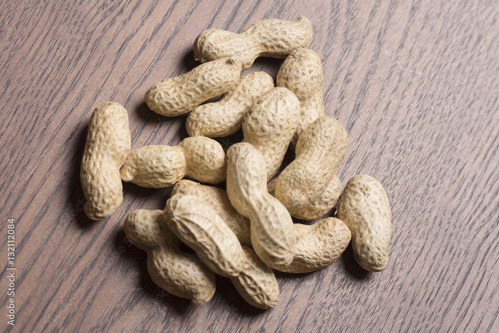 Peanuts on wooden background Peanuts on wooden background