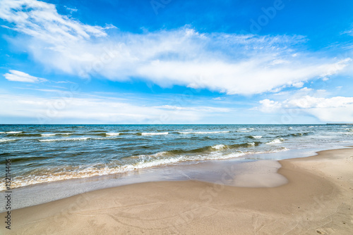 Blue sky and sea beach, landscape, coast with waves in the summer vacation, Poland, Baltic