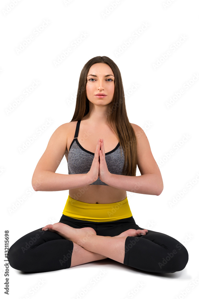 Yoga. Portrait of a beautiful sports girl on a white background