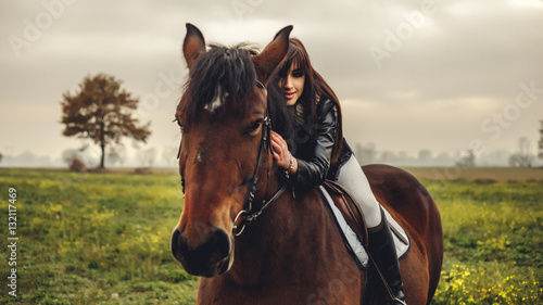 Beautiful girl riding a horse