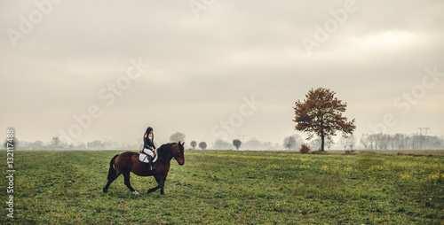 Beautiful girl riding a horse