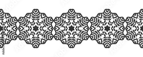 Snowflake. Christmas seamless pattern. Circular ornament and decorative lace.