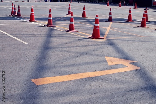 orange traffic cones in outdoor parking lot