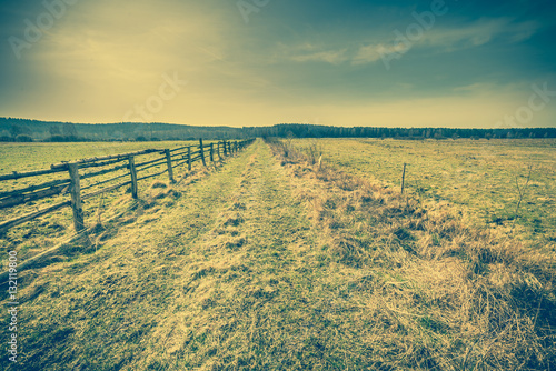 Wooden fence on field, landscape