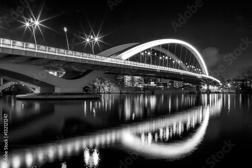 Illuminated bridge Raymond Barre over the Rhone river in Lyon at night.