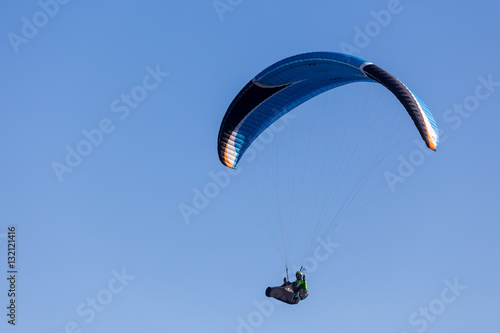 one paragliding in the sky