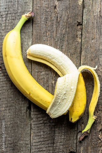 Ripe bananas on wooden table