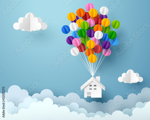 Paper art of house hanging with colorful balloon