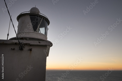 The lighthouse at sunset on the Sheeps Head Peninsula County Cork Ireland